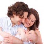 parents_holding_baby_193894