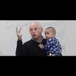 Photo of professor holding baby