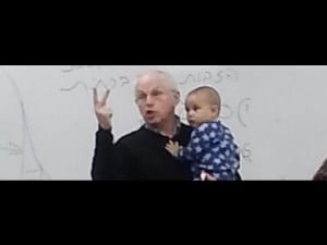 A photo of professor holding student's baby goes viral photo of professor holding student's baby