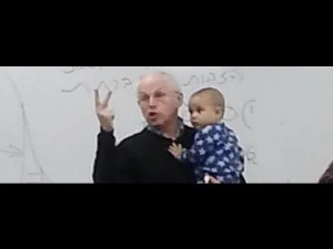 photo of professor holding student's baby
