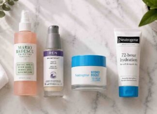 Skincare routine for combination skin UK laid out on a marble surface including cleanser, niacinamide serum, moisturiser and SPF