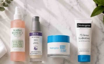 Skincare routine for combination skin UK laid out on a marble surface including cleanser, niacinamide serum, moisturiser and SPF