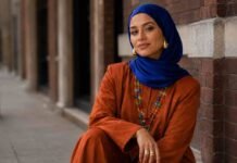 jewellery trends UK 2026 with cobalt blue hijab, burnt orange co-ord set and colourful layered statement necklace