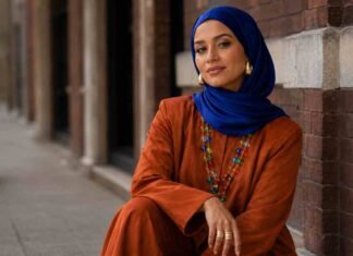 jewellery trends UK 2026 with cobalt blue hijab, burnt orange co-ord set and colourful layered statement necklace