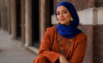 jewellery trends UK 2026 with cobalt blue hijab, burnt orange co-ord set and colourful layered statement necklace