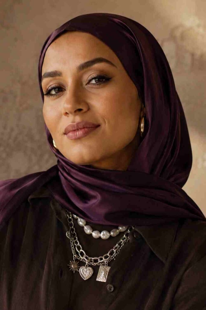 Jewellery Trends UK 2026: The Pieces Every Woman Is Wearing Right Now jewellery trends UK 2026 featuring deep plum satin hijab with layered pearl and silver charm necklaces