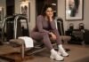 How to Build an Effortless Sports Luxe Wardrobe for Autumn 2026 sports luxe fashion trends: Woman in a matte sports luxe wardrobe co-ord by a bright window